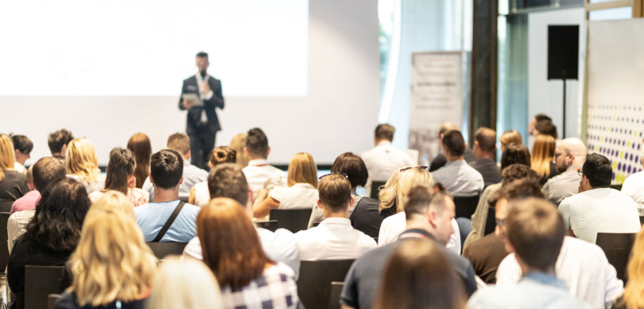 background image of someone giving a presentation